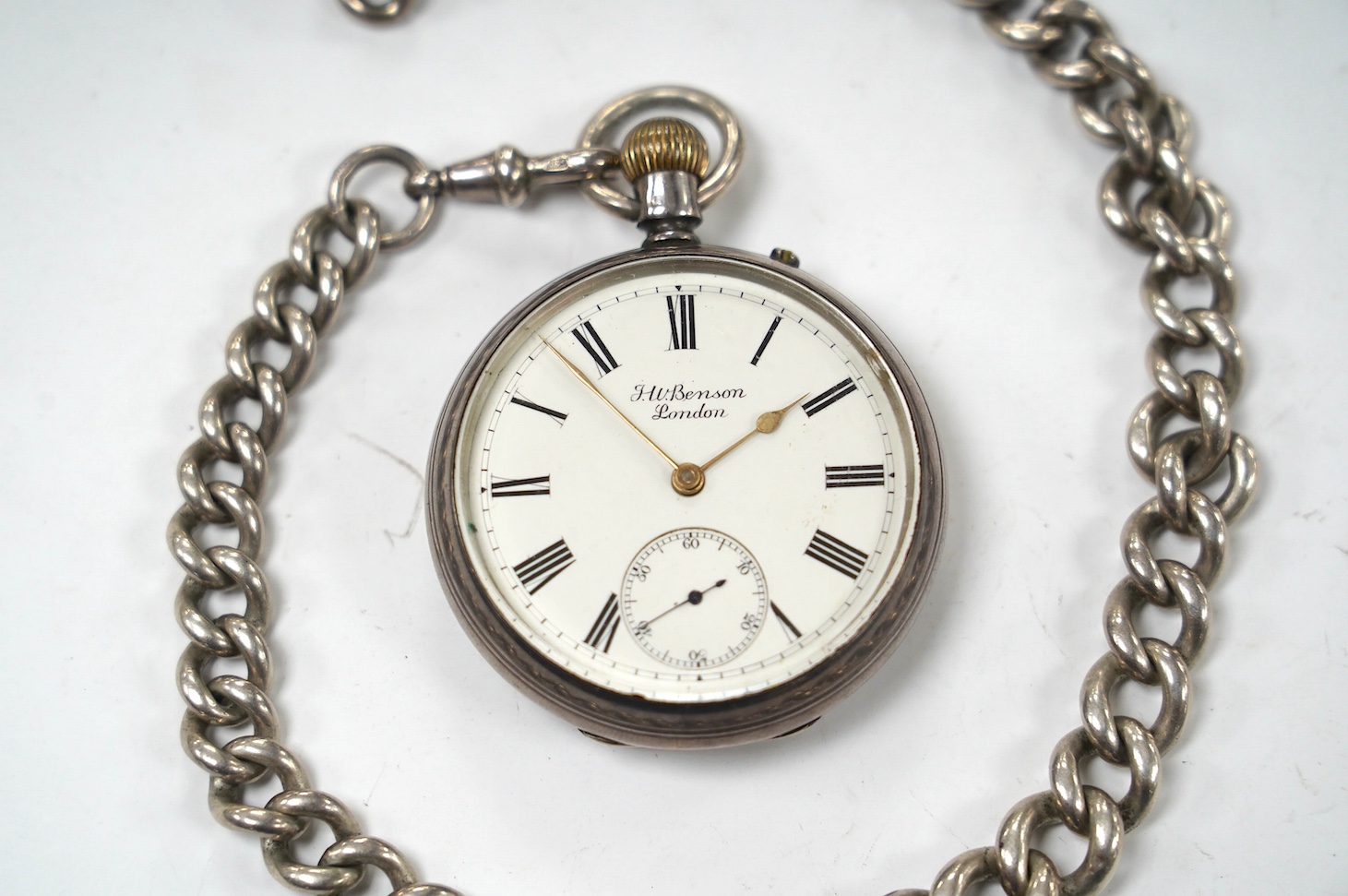 A late Victorian silver open face pocket watch, by J.W. Benson, with Roman dial and subsidiary seconds, together with a silver albert. Condition - poor to fair